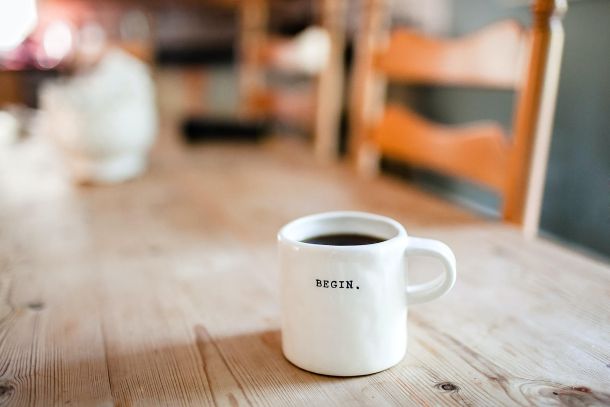 coffee mug on a wood table indoors