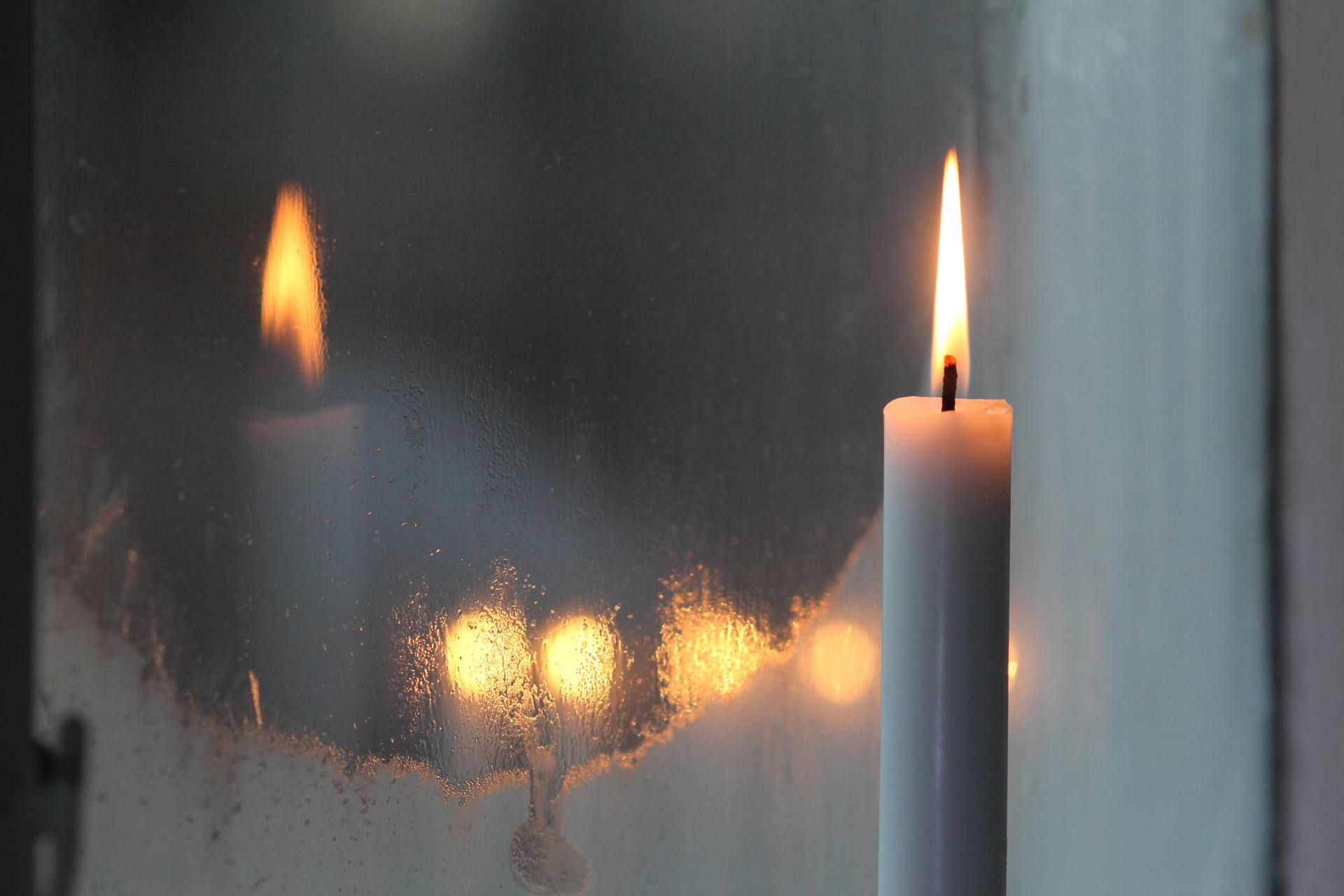 candle in front of a mirror on fire