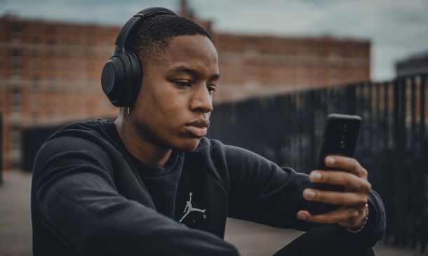 man listening outdoors