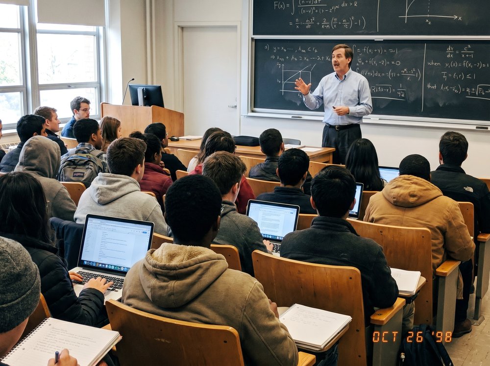 Dr. Snow teaching at the chalkboard
