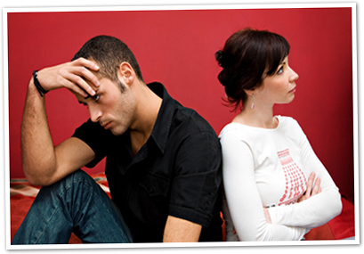 A husband and wife sitting apart, the distance between them growing
